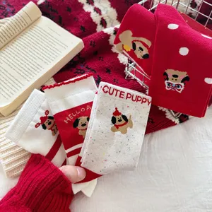 Red New Year cotton crew socks with cute puppy cartoon patterns and playful polka dots.