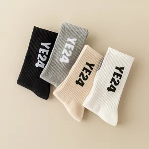 Classic high-tube cotton socks in four colors with stylish letters design for daily wear.