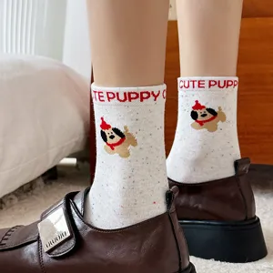 Cute puppy embroidered speckled yarn mid-calf socks detail shot, festive winter red theme.