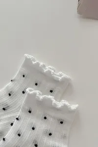 Summer white mesh socks with black polka dots and cute lettuce ruffle edges, lightweight design.