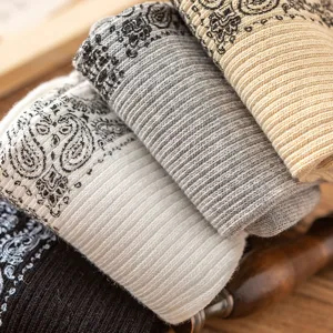 Detailed shot of retro paisley print double-needle cotton socks, featuring soft ribbed texture.