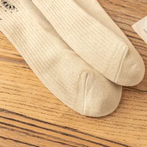 Beige cotton double needle socks with knit rib texture and print detail for spring autumn.