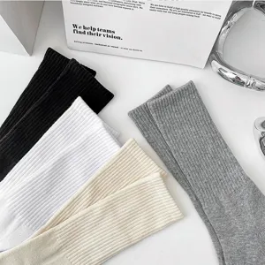 Men's solid color ribbed mid-tube cotton sports socks in black white grey beige colors.