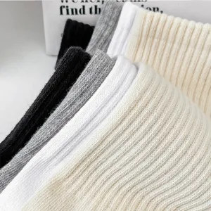 Men solid color ribbed mid tube cotton socks detail stack view showcasing soft breathable knit.
