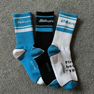 Streetwear UNC blue mid-calf cotton socks for men, trendy skateboard casual athletic socks.