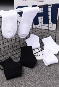 Unisex cotton sports socks in black and white, casual crew and short socks for daily wear.