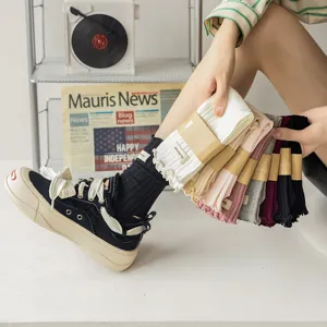 Detailed close-up view of women cotton ribbed mid-calf socks showcasing sweet lettuce edge and tags.