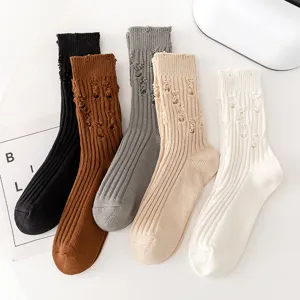 Detailed view of trendy distressed mid-calf cotton socks in multiple colors for daily wear.