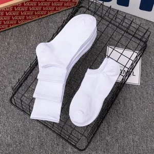 White sports crew socks and short socks detailed view, clean and comfortable everyday wear.