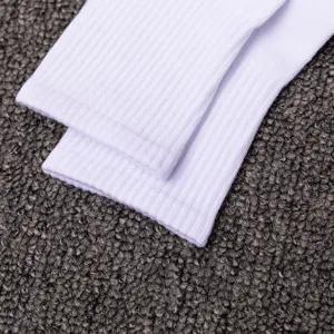 White ribbed mid-tube sports socks, cotton breathable athletic socks for men and women detail.
