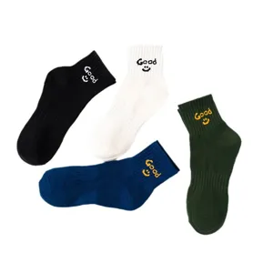 Unisex cotton socks featuring good letter embroidery and cute smiley face design, casual style.