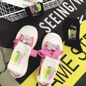 Fashion canvas sneakers and embroidered socks set with colorful letter and stylish graffiti designs.