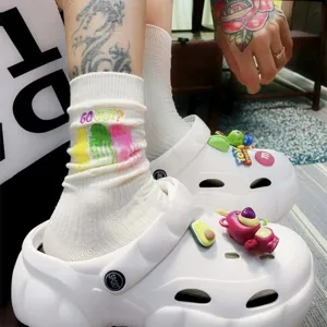 White mid-calf stack socks with colorful graffiti print and embroidered letters for daily wear.