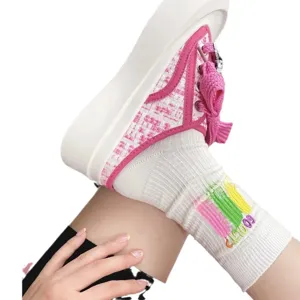 Trendy colorful embroidered slouch socks with ink splash design, comfortable cotton fashion socks.