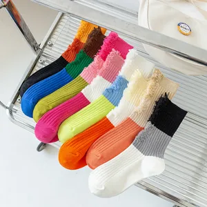 Colorful color block distressed crew socks for women, fashionable spring and summer thin stack socks.
