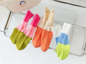 Detailed view of colorful distressed crew socks, featuring trendy color blocking and ripped design.