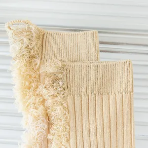 Close-up of women distressed fringe knit socks, soft cotton texture for spring summer.