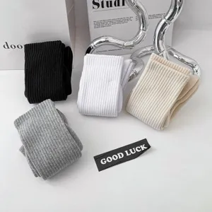Detailed view of men solid color ribbed cotton mid crew socks in black white grey beige colors.