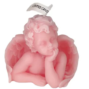 Cute pink cherub scented candle, adorable angel resting head design for home decor and gifts.