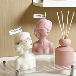 Scented candle blindfolded female bust aesthetic home decor ornament and reed diffuser.