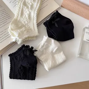 Detailed view of hollow-out cotton women short socks with cute bowknot design, casual style.