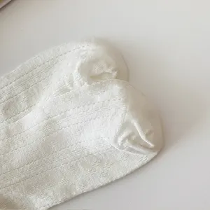 Close-up detail of white mesh hollow casual women socks showing breathable fabric texture.