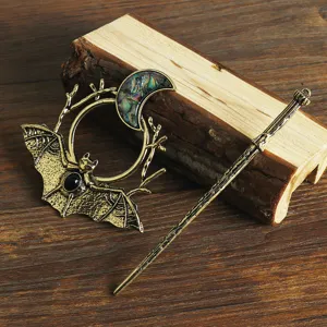Detailed view of the vintage retro bat and crescent moon alloy hair stick accessory.