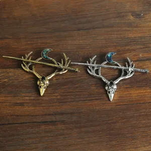 Close-up detail of retro vintage Viking deer skull hair pin gothic hair accessory.