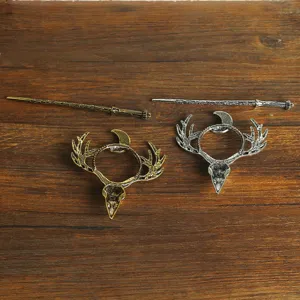Detailed view of vintage viking raven skull and antler hair pin set, gothic hair accessories.