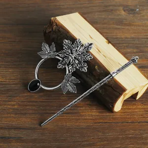 Detailed view of the vintage Viking retro alloy hair stick and cloak pin with leaf and black gem.