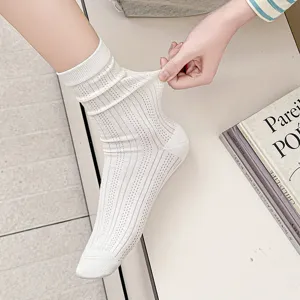 Detailed view of women's white vertical striped breathable mesh stacking socks showing stretch.