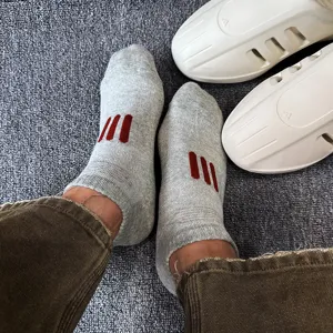 Grey short socks with red stripes, comfortable cotton knit casual daily wear breathable apparel.