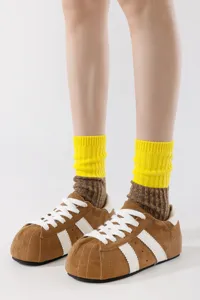 Colorblock mid-calf knit socks featuring a stylish yellow and brown design, cozy and breathable.