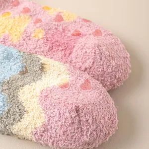 Detailed view of super soft fuzzy coral fleece winter floor socks with anti-slip silicone dots.
