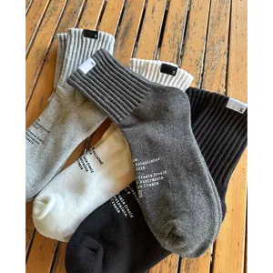 Casual cotton mid-calf socks for men, breathable solid color streetwear socks with vintage print.