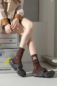 Brown distressed knit crew socks for women, vintage style tall stack socks with embroidery.