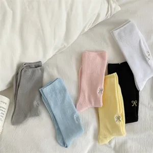 Detailed view of cute ribbed mid-tube cotton socks featuring sweet bow embroidery.