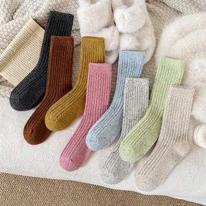 Detailed view of cozy thick wool crew socks with cute speckled design for autumn winter.