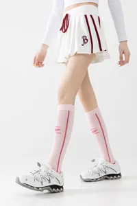 Breathable compression sports socks detail, comfortable women's fitness knee-high wear.