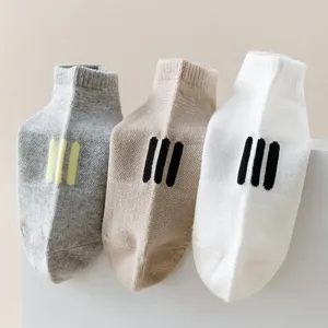 Comfortable mesh low-cut socks with minimalist three-bar design, breathable cotton casual wear.