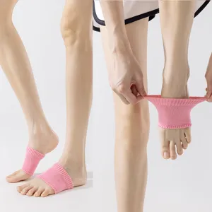 Close-up detail of pink knit arch support socks, showing the elastic ribbed band and foot fit.