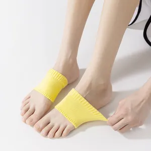 Yellow knit arch support socks detail, stretch foot sleeves for women daily comfort wear.
