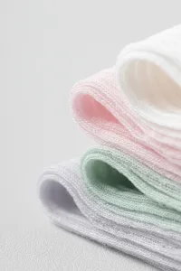 Detailed close-up of ultra-thin silk mesh mid-tube socks showing delicate fabric texture.