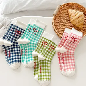 Korean style cute plaid bow crew socks for women, soft cotton casual mid tube hosiery daily wear.