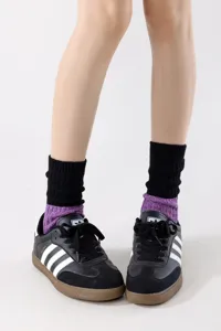Knitted mid-tube socks detail view, color-blocked textured cotton fashion socks close-up.