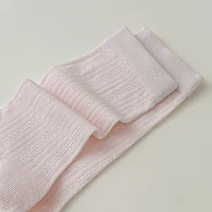 Close-up detail of light pink women breathable mesh vertical stripe slouch socks, soft texture.