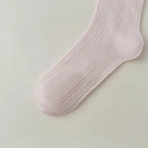 Women pink ribbed mesh mid-calf sock detail view, breathable summer casual hosiery item.