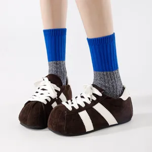 Color-blocked mid-calf socks paired with trendy brown plush bread shoes for daily casual wear.