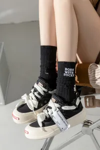 Distressed ribbed embroidered mid-calf socks for women, stylish slouch cotton knit socks.