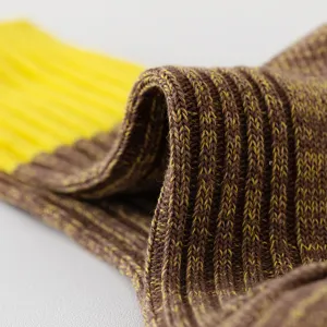 Close-up detail of thick knitted color-contrast mid-tube socks, breathable cotton texture.